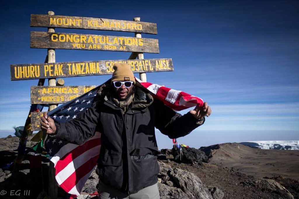 Sporting a successful Kilimanjaro summit smile!
